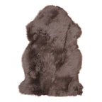 Bruin lamsvachtkleed van echt lamsleer op houten vloer