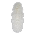 Kunstlamsvachtkleed in ivoorkleur op vloer